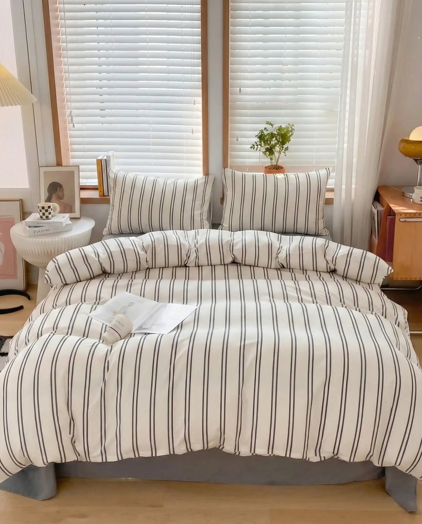 Neutral striped duvet cover styled in a bright bedroom with natural light, creating a calm, airy sleep space with timeless appeal.