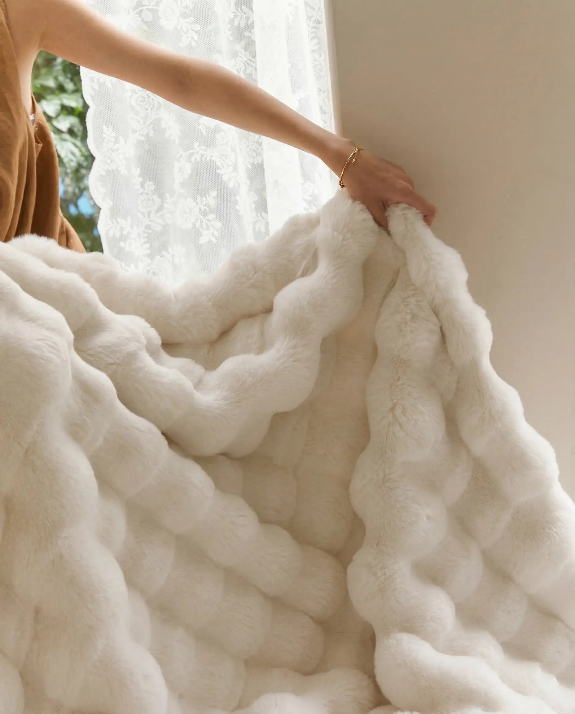 Close up of DORMÉ Studio Marshmallow Ultra Plush Blanket showing thick sculpted plush texture and soft premium fabric.