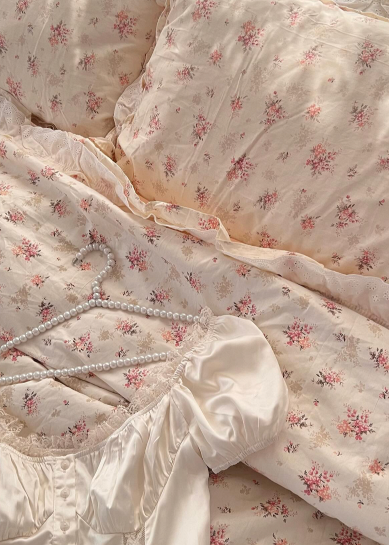 Floral patterned fabric with a hanger on a matching background