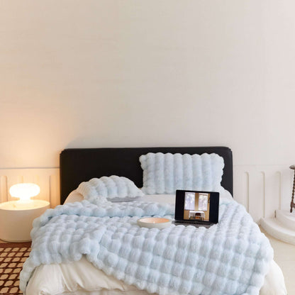 VibeCore Marshmallow Ultra Plush Blanket Pastel Blue On Bed, showcasing it's aesthetic and luxurious appeal.