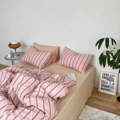 Alternative aerial side view of the VibeCore Pink Stripe Bedding Set, showcasing its stylish soft pink stripes and 100% breathable cotton material. This modern bedding set adds a cozy and chic touch to any bedroom or dorm, perfect for enhancing your space with effortless style and comfort.
