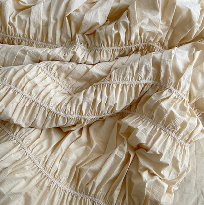 Close-up of the intricate detailing on the VibeCore Royal Pleated Bedding Set, showcasing the soft cotton fabric and elegant pleated accents that elevate its luxurious and romantic aesthetic.