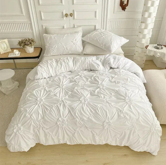 Aerial view of the VibeCore Aesthetic Tufted Floral Pattern Duvet Cover Set in white, showcasing its soft, textured floral blooms and sleek design that adds a cozy yet modern touch to any bedroom or dorm, creating an aesthetic and inviting atmosphere.