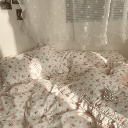 VibeCore Coquette Embroidered Pink Floral Duvet Cover Set aerial front view close-up, showcasing delicate floral embroidery and soft cotton texture in intricate detail.