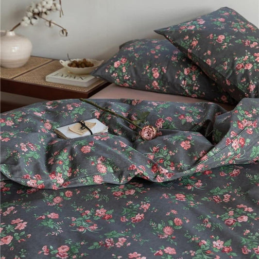Close-up view of the VibeCore Cottagecore Black Floral Duvet Cover Set, featuring detailed floral embroidery on a dark background, perfect for adding a vintage, nature-inspired touch to your bedroom or dorm.