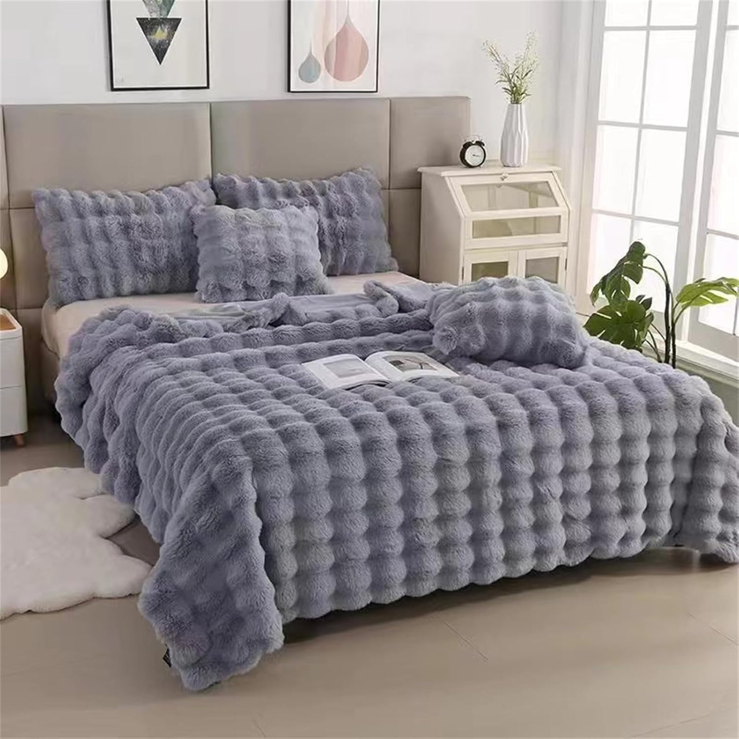 VibeCore Marshmallow Ultra Plush Blanket Gray Angled Front View On Bed, demonstrating it's aesthetic and cozy appeal.