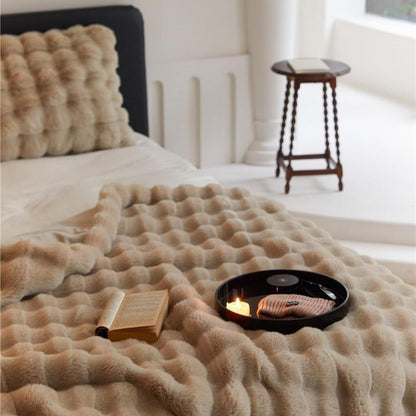 VibeCore Marshmallow Ultra Plush Blanket Khaki Close Up On Corner Of Bed, demonstrating the coziness and color.