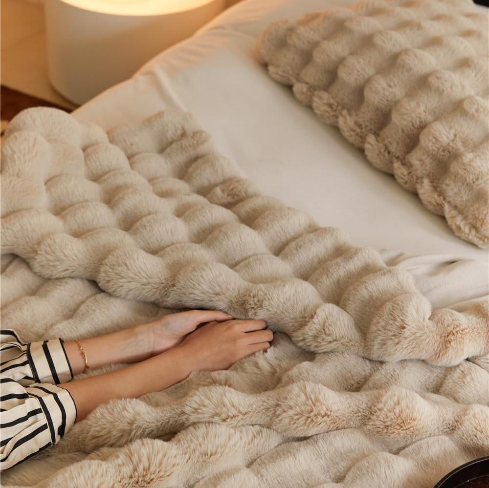 VibeCore Marshmallow Ultra Plush Blanket Khaki Woman Feel It, demonstrating the ultra soft material.