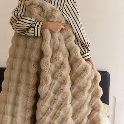 VibeCore Marshmallow Ultra Plush Blanket Khaki Woman Holding It, showing the cosiness and luxurious feel of the blanket.