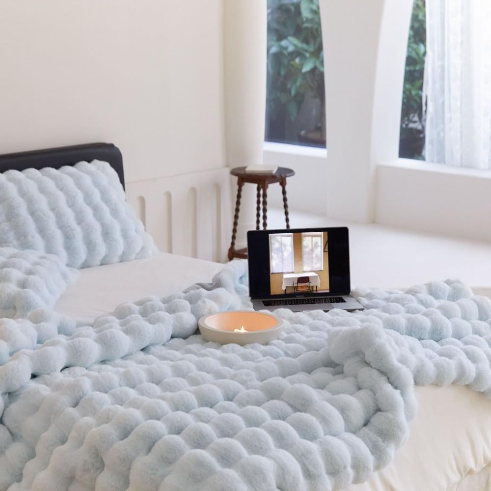 VibeCore Marshmallow Ultra Plush Blanket Pastel Blue On Bed Angled Close Up showcasing the tufted design and soft feel 