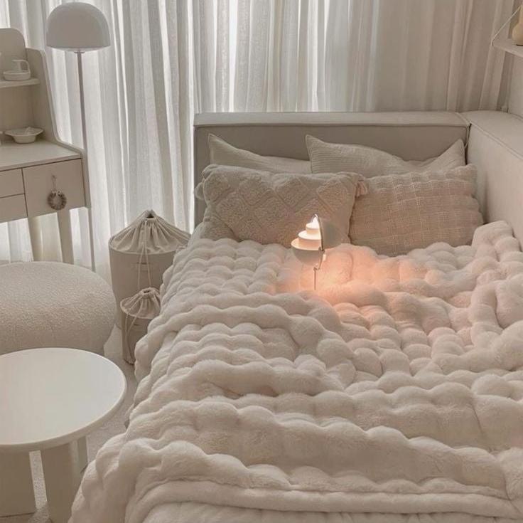 VibeCore Marshmallow Ultra Plush Blanket White On Bed Close Up, featuring its soft plush white texture and aesthetic appeal.
