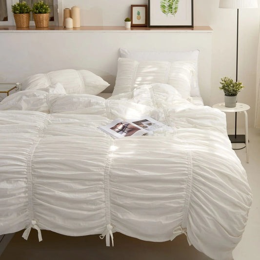 White ruched duvet cover set front view on bed, aesthetic cotton bedding with tufted details, cozy breathable cotton, elegant room decor, VibeCore fleece duvet_cover set, romantic minimalist style, soft white bedding, coquette bedroom inspiration, dreamy timeless design, luxury twin or king bedding set.